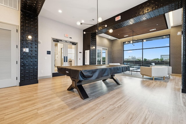 1014 16th Ave S Unit 103, Nashville, TN 37212 - recreation room featuring wood finished floors, a towering ceiling, pool table, french doors, and recessed lighting