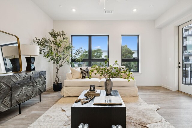 1014 16th Ave S Unit 103, Nashville, TN 37212 - living room with wood finished floors, plenty of natural light, and recessed lighting