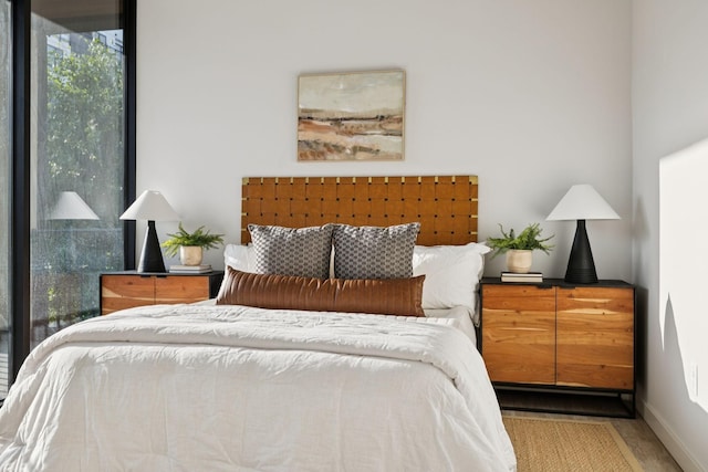 1014 16th Ave S Unit 103, Nashville, TN 37212 - bedroom with wood finished floors and baseboards