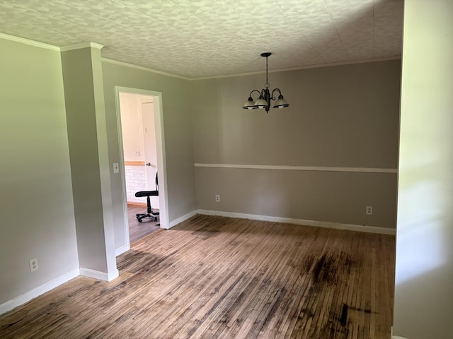 125 Benco Ln, Camden, TN 38320 - empty room with a chandelier, wood finished floors, and ornamental molding