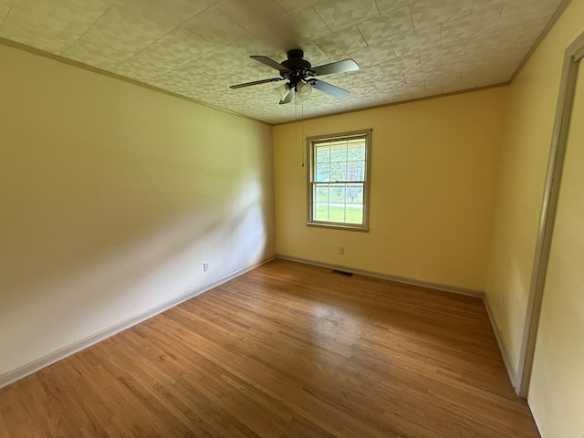 125 Benco Ln, Camden, TN 38320 - empty room with wood finished floors and ceiling fan