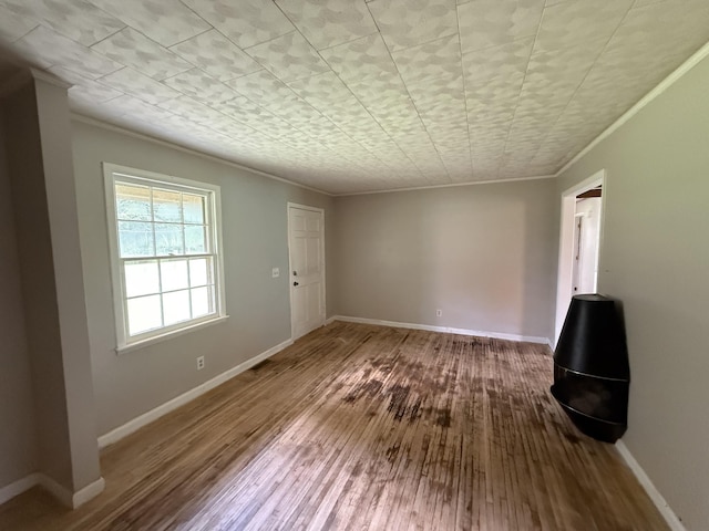 125 Benco Ln, Camden, TN 38320 - unfurnished living room with ornamental molding and hardwood / wood-style flooring