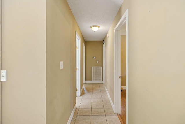 5 Old Chisholm Creek Rd, Lawrenceburg, TN 38464 - hallway featuring a textured ceiling and light tile patterned floors