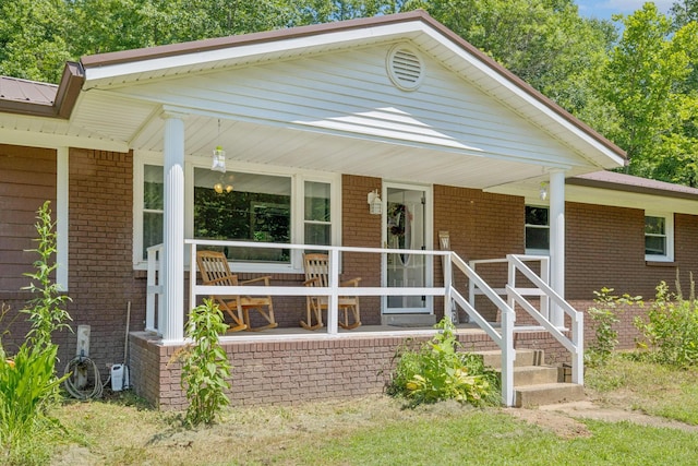 5 Old Chisholm Creek Rd, Lawrenceburg, TN 38464 - view of front of home featuring a porch, brick siding, and a metal roof