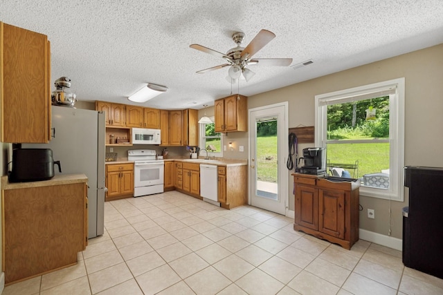 5 Old Chisholm Creek Rd, Lawrenceburg, TN 38464 - kitchen with white appliances, a ceiling fan, light countertops, plenty of natural light, and a textured ceiling