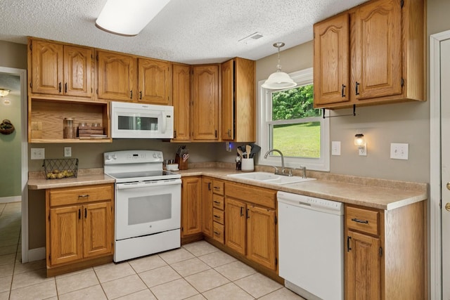 5 Old Chisholm Creek Rd, Lawrenceburg, TN 38464 - kitchen with white appliances, light tile patterned floors, brown cabinetry, a textured ceiling, and light countertops