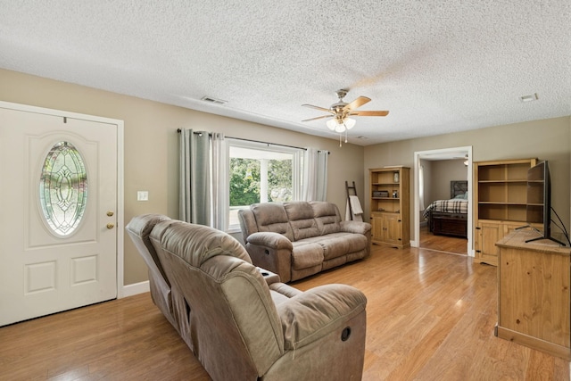5 Old Chisholm Creek Rd, Lawrenceburg, TN 38464 - living area with light wood-style floors, a ceiling fan, and a textured ceiling