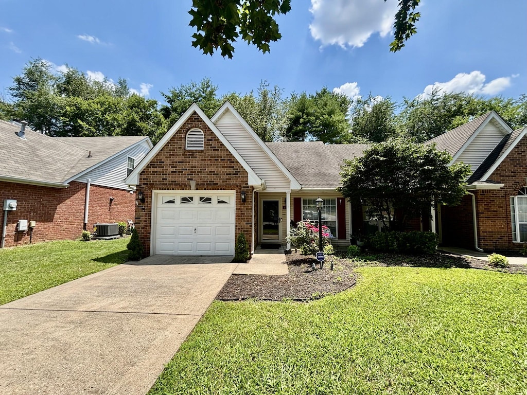 610 Messick Ct, Murfreesboro, TN 37130 - ranch-style house featuring a garage, brick siding, driveway, and a front lawn