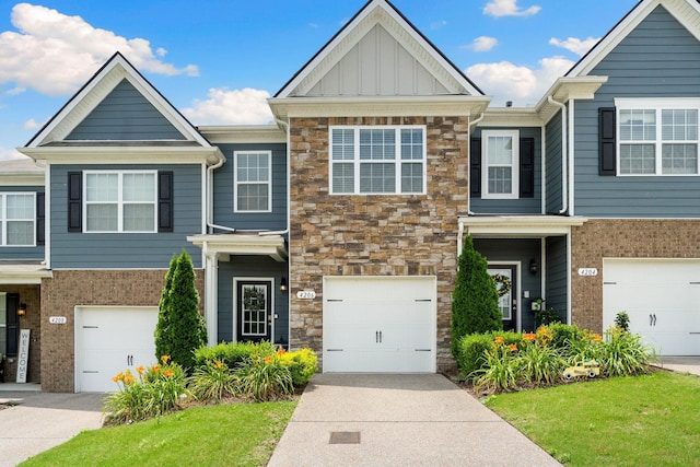 4206 Grapevine Loop, Smyrna, TN 37167 - multi unit property with stone siding, board and batten siding, driveway, and a garage