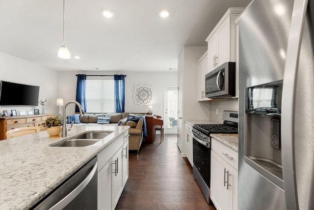 4206 Grapevine Loop, Smyrna, TN 37167 - kitchen featuring stainless steel appliances, open floor plan, dark wood-style flooring, white cabinets, and recessed lighting