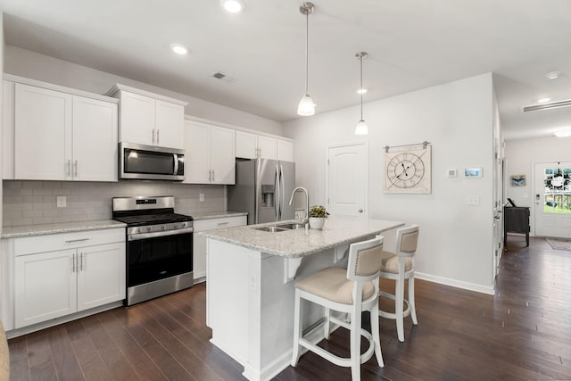 4206 Grapevine Loop, Smyrna, TN 37167 - kitchen featuring stainless steel appliances, dark wood-style floors, backsplash, recessed lighting, and white cabinets