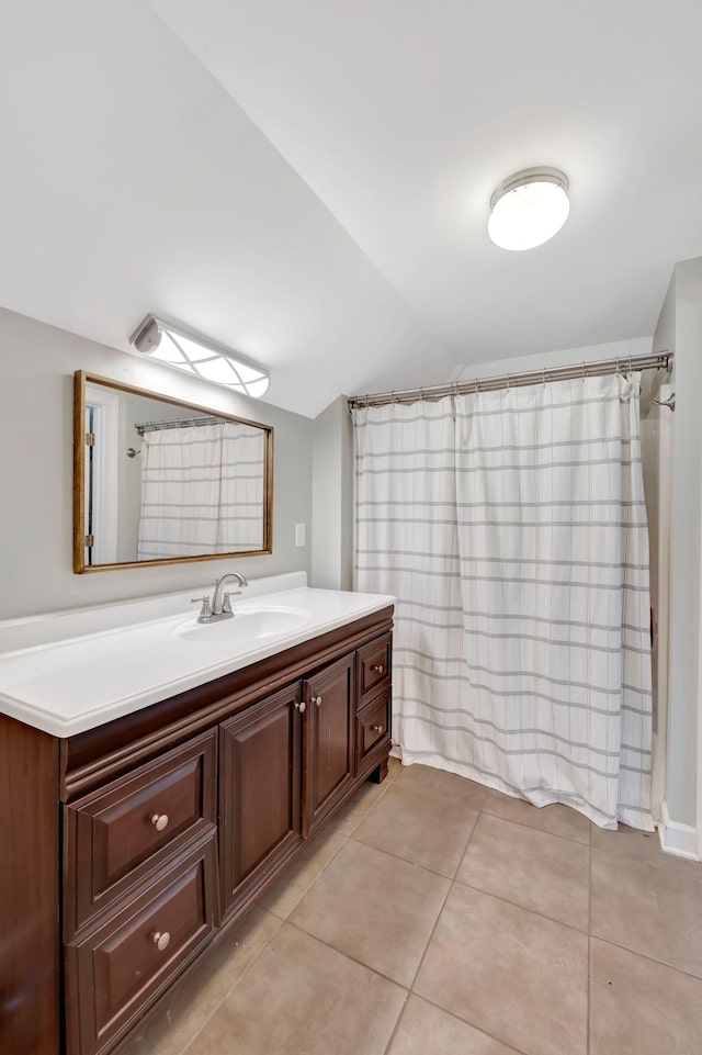 904 Oxford Ct, Brentwood, TN 37027 - bathroom featuring vanity, lofted ceiling, and tile patterned flooring