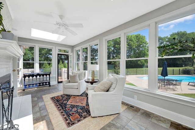 904 Oxford Ct, Brentwood, TN 37027 - sunroom / solarium featuring a skylight, stone tile floors, and plenty of natural light