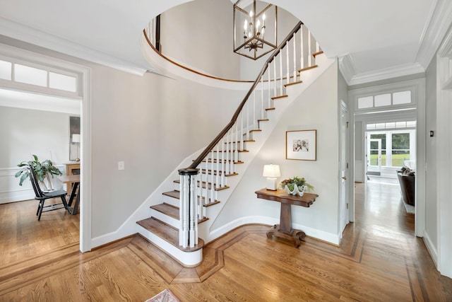 904 Oxford Ct, Brentwood, TN 37027 - stairway with crown molding, wood finished floors, and a chandelier