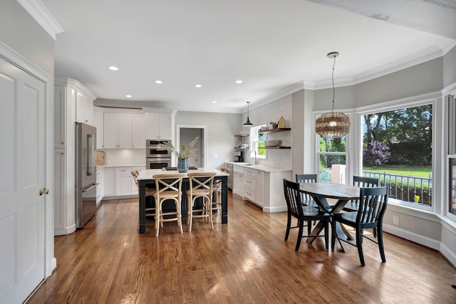 904 Oxford Ct, Brentwood, TN 37027 - dining room featuring ornamental molding, dark wood-type flooring, recessed lighting, and a chandelier