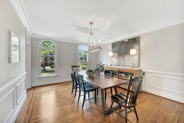 904 Oxford Ct, Brentwood, TN 37027 - dining area with ornamental molding, a decorative wall, wood finished floors, wainscoting, and a chandelier