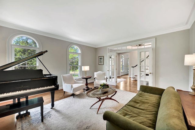 904 Oxford Ct, Brentwood, TN 37027 - living room with wood finished floors, healthy amount of natural light, crown molding, french doors, and stairway