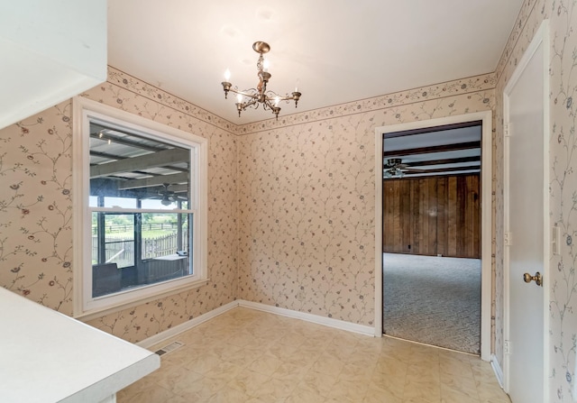 2208 Bowman Rd, Franklin, TN 37064 - unfurnished dining area featuring a chandelier, wallpapered walls, and light floors