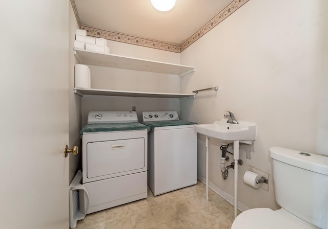 2208 Bowman Rd, Franklin, TN 37064 - laundry room featuring washing machine and dryer and light marble finish flooring