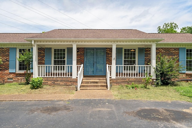 2208 Bowman Rd, Franklin, TN 37064 - view of front facade with brick siding, covered porch, and a shingled roof