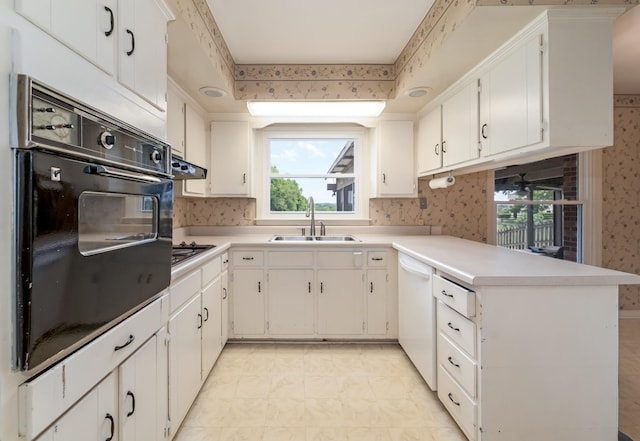 2208 Bowman Rd, Franklin, TN 37064 - kitchen with oven, dishwasher, wallpapered walls, a peninsula, and healthy amount of natural light