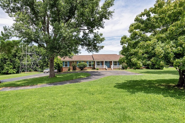 2208 Bowman Rd, Franklin, TN 37064 - single story home with a front yard, driveway, and brick siding