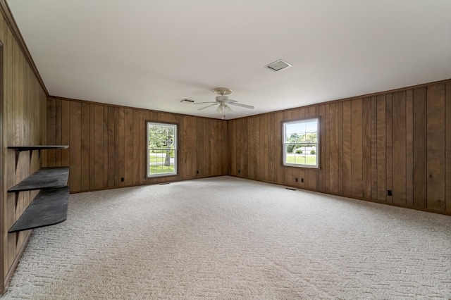 2208 Bowman Rd, Franklin, TN 37064 - unfurnished living room with a ceiling fan, light colored carpet, and wood walls