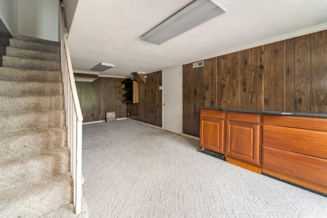 2208 Bowman Rd, Franklin, TN 37064 - finished basement with stairway, wood walls, and light colored carpet