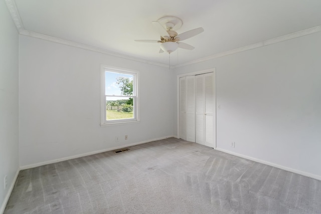 2208 Bowman Rd, Franklin, TN 37064 - spare room featuring ornamental molding, ceiling fan, and carpet flooring
