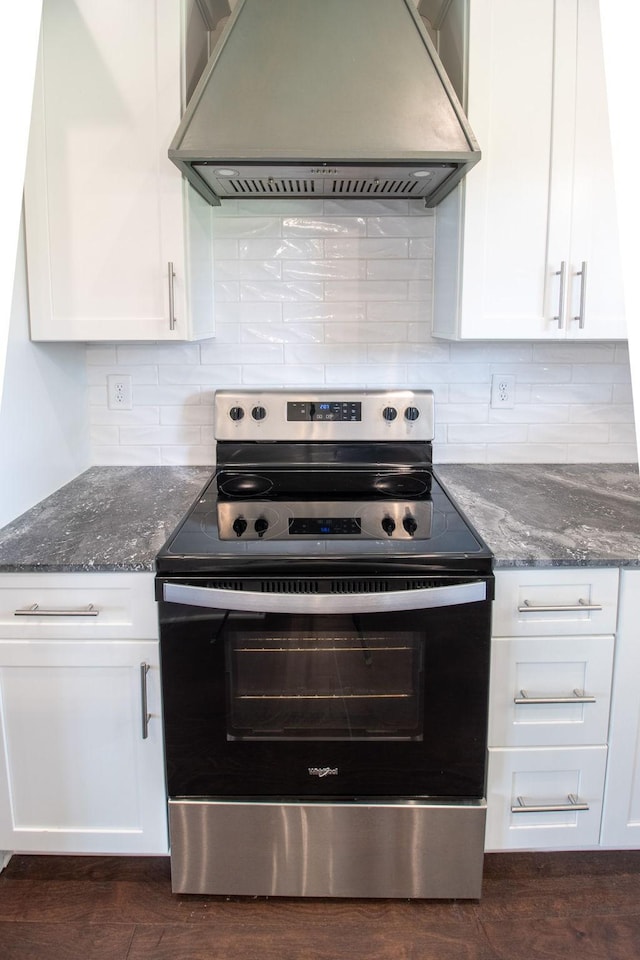 264 Dink Rut Rd, Portland, TN 37148 - kitchen with stainless steel electric stove, custom range hood, white cabinets, dark stone countertops, and decorative backsplash