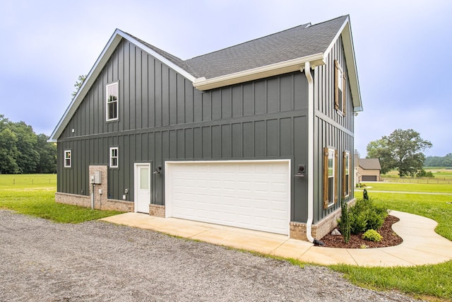 264 Dink Rut Rd, Portland, TN 37148 - view of property exterior with board and batten siding, a shingled roof, a garage, and gravel driveway