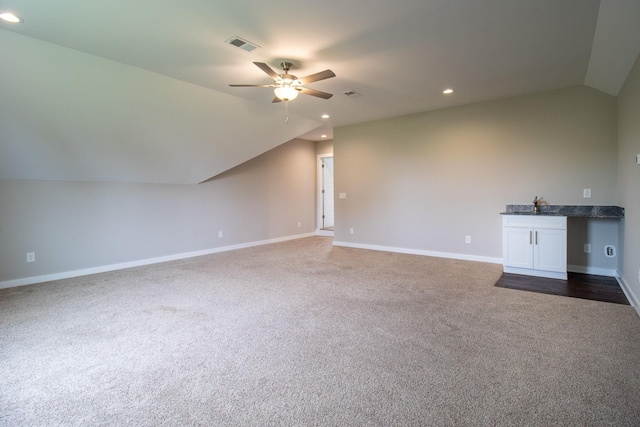 264 Dink Rut Rd, Portland, TN 37148 - unfurnished living room with vaulted ceiling, a ceiling fan, dark colored carpet, and recessed lighting