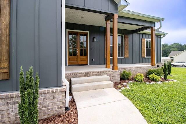 264 Dink Rut Rd, Portland, TN 37148 - doorway to property with board and batten siding, a porch, and a yard