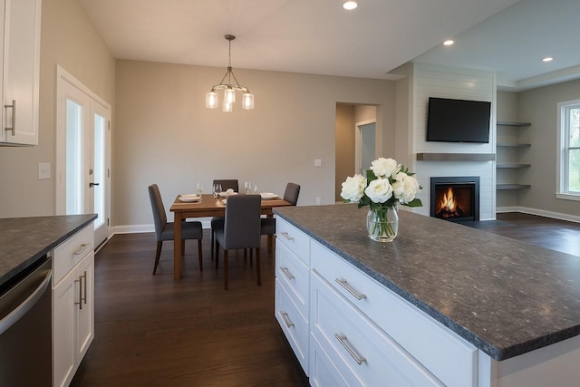 264 Dink Rut Rd, Portland, TN 37148 - kitchen with dishwasher, white cabinets, dark wood-type flooring, open floor plan, and a fireplace