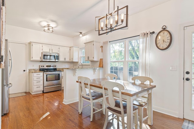 824 W Benjamin Ct, Franklin, TN 37067 - dining space featuring light wood-style floors and a chandelier