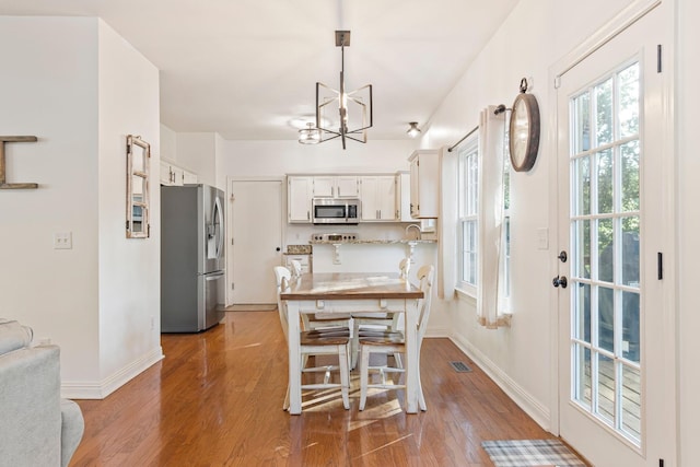 824 W Benjamin Ct, Franklin, TN 37067 - dining room with a chandelier and wood finished floors