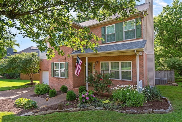 824 W Benjamin Ct, Franklin, TN 37067 - view of front of property featuring a front yard, brick siding, covered porch, concrete driveway, and roof with shingles
