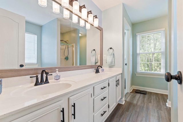 824 W Benjamin Ct, Franklin, TN 37067 - bathroom featuring double vanity, healthy amount of natural light, wood finished floors, and a shower