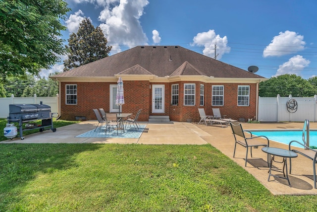 919 Compton Rd, Murfreesboro, TN 37130 - back of property with brick siding, a fenced backyard, a patio area, and roof with shingles