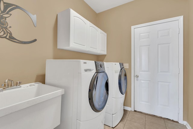 919 Compton Rd, Murfreesboro, TN 37130 - laundry area with washing machine and clothes dryer, cabinet space, and light tile patterned floors