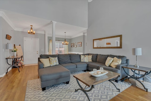 919 Compton Rd, Murfreesboro, TN 37130 - living room with a chandelier, light wood finished floors, ornamental molding, and ornate columns