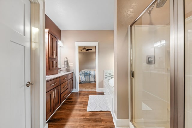 3092 Morel Rd, Columbia, TN 38401 - full bath with ceiling fan, a shower stall, wood finished floors, a garden tub, and double vanity