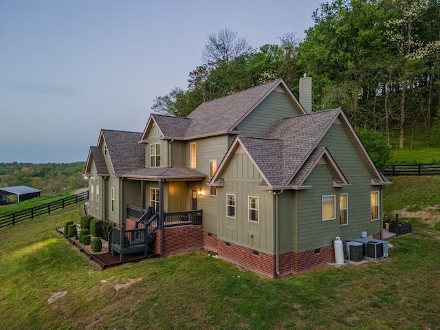 3092 Morel Rd, Columbia, TN 38401 - view of front facade with crawl space, board and batten siding, a chimney, a shingled roof, and covered porch