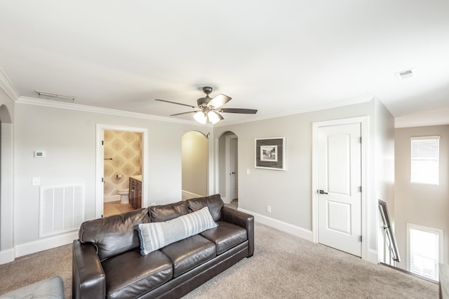 1328 Reynard Dr, Gallatin, TN 37066 - living room with arched walkways, ceiling fan, ornamental molding, and carpet