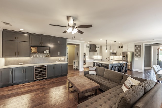 1328 Reynard Dr, Gallatin, TN 37066 - living room featuring wine cooler, ornamental molding, a ceiling fan, dark wood finished floors, and recessed lighting