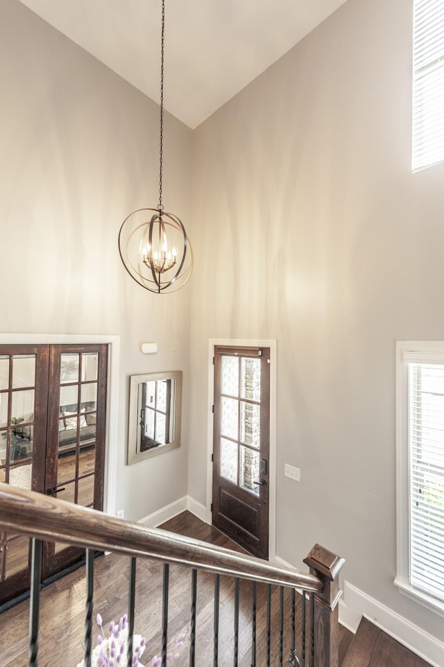 1328 Reynard Dr, Gallatin, TN 37066 - foyer entrance featuring high vaulted ceiling, a chandelier, dark wood finished floors, french doors, and healthy amount of natural light