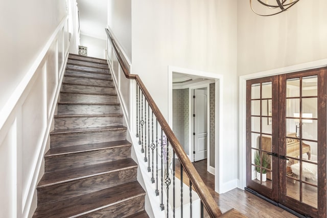 1328 Reynard Dr, Gallatin, TN 37066 - stairway featuring french doors, a towering ceiling, and wood finished floors