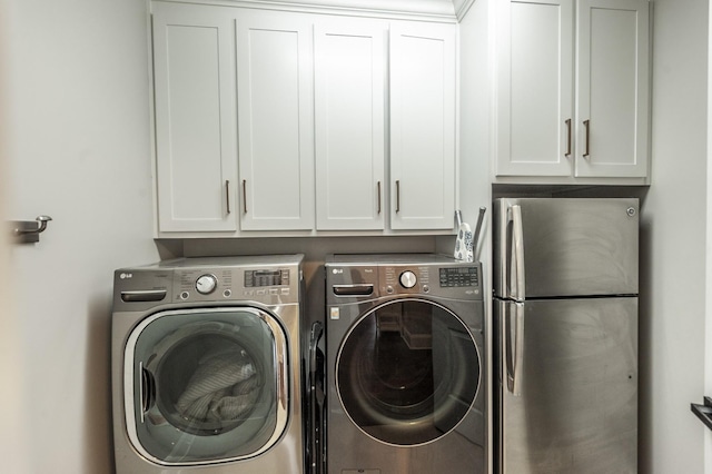 1328 Reynard Dr, Gallatin, TN 37066 - laundry area featuring washer and clothes dryer and cabinet space