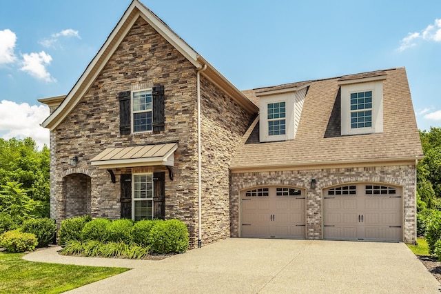 1328 Reynard Dr, Gallatin, TN 37066 - view of front of house with stone siding, concrete driveway, a garage, and roof with shingles