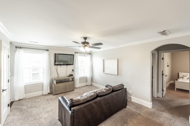 1328 Reynard Dr, Gallatin, TN 37066 - living area featuring arched walkways, crown molding, light colored carpet, and a ceiling fan